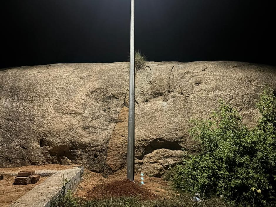 A solar street light lighting rocky ground at Chittoor